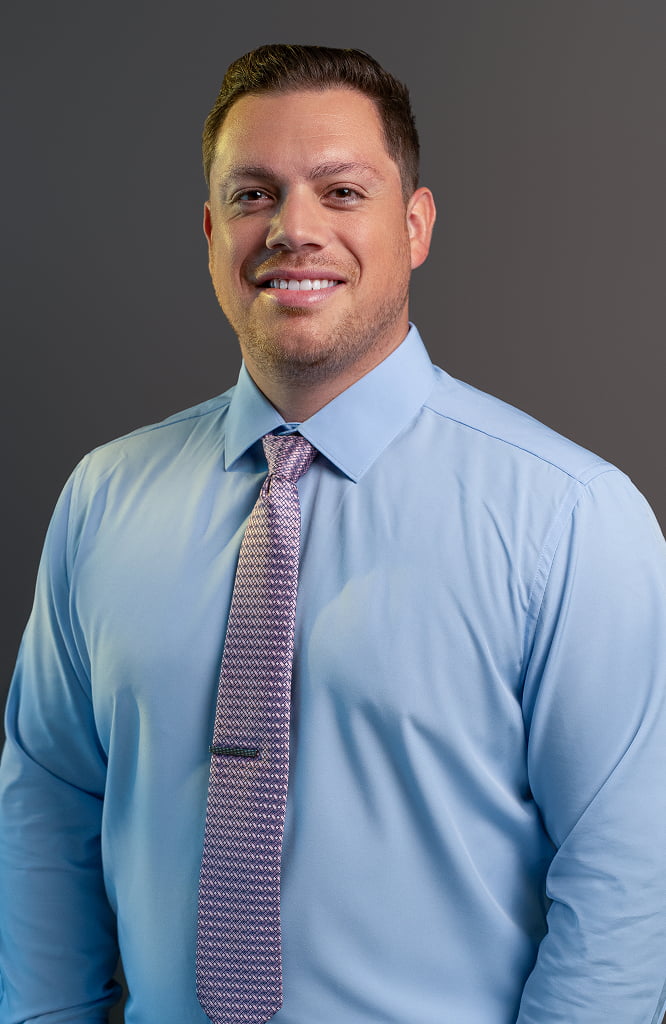 Headshot of Dr. Raz wearing a suit